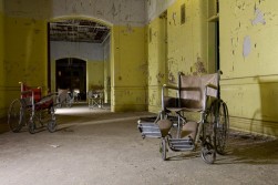 <p>Empty wheelchairs posed in Buffalo State Hospital, Buffalo, NY. Image by Ian Ference.</p>
